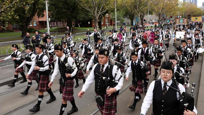 Servicemen and women marching to honour fallen soldiers. Picture: AFP