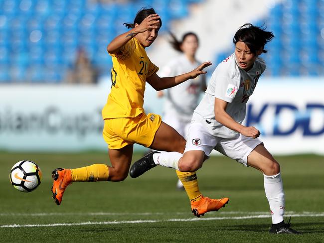 Saki Kumagai of Japan and Samantha May Kerr of Australia in action.