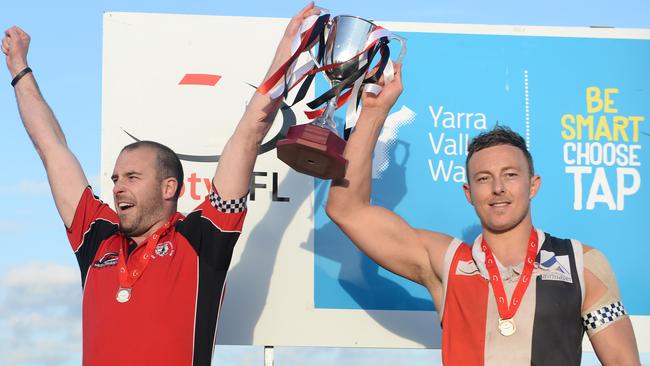 Brett Moyle hoists the premiership cup aloft in 2014 with Max Melzer.