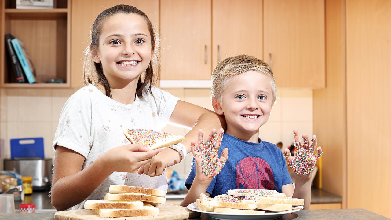 Siblings, Sophie, 9 and Oscar, 5, making fairy bread. Picture: Luke Bowden