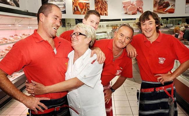 Berties the Bargain Butcher's owner manager Brad Holloway gets a farewell hug from long term employee Roby Peaty with apprentce William Finlay, new manager Paul Clark and apprentice Rick Armbruster looking on. Picture: Jacklyn Wagner