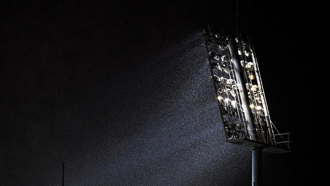 A light tower is seen as rain falls during the 2018 Summer of Athletics Grand Prix at Queensland Sport and Athletics Centre in Brisbane. Thieves are allegedly targeting lighting cables and other infrastructure at Toowoomba sports facilities.