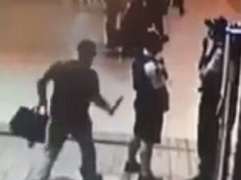 Exclusive to Daily TelegraphScreengrabs from a supplied video of a man stabbing a Police Officer in the back with a knife at Sydney's Central Station on Friday the 19th of April at 6.45pm