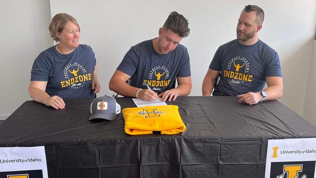 Malakai Railton-Stewart (middle) very happy on signing day.