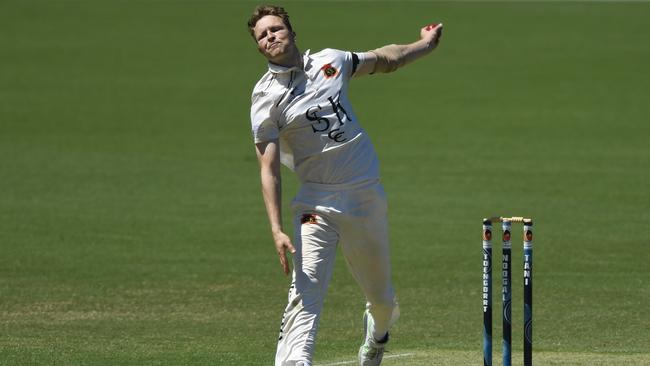 Josh Bartlett in sends one down for St Kilda.