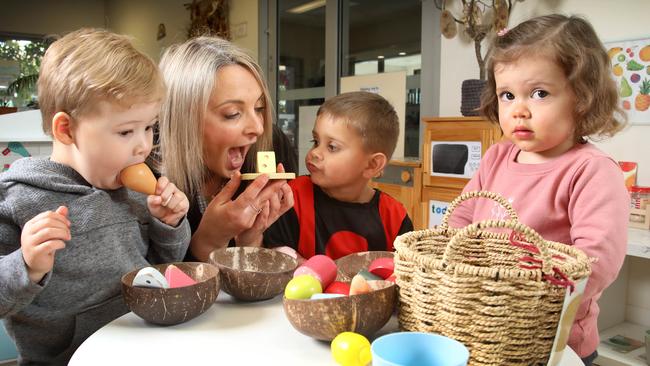 Goodstart Early Learning Centre Somerton Park director Anna Burton with Oakley, Izekia and Livia. Goodstart – a national not-for-profit operator – is South Australia’s largest childcare operator. Picture: Dean Martin