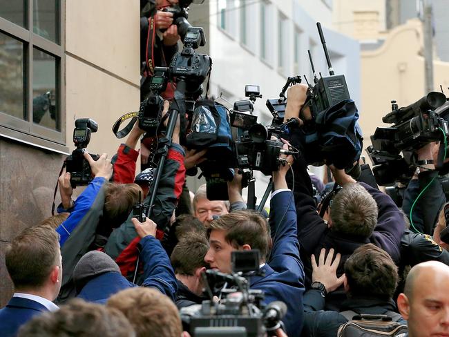 Cardinal Pell was swamped by the crowd as he left court. Picture: Mark Stewart