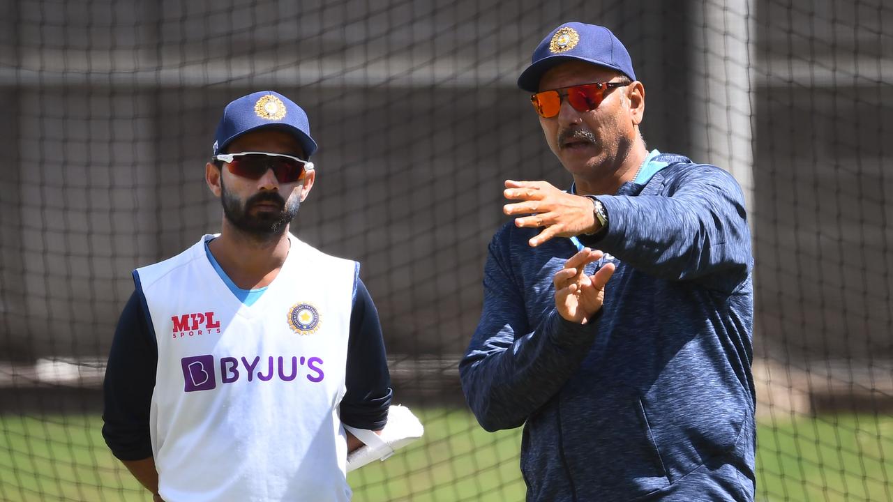 India's captain Ajinkya Rahane (L) chats with coach Ravi Shastri (R) during a training session ahead of the second cricket Test match against Australia, in Melbourne on December 24, 2020. (Photo by William WEST / AFP) / --IMAGE RESTRICTED TO EDITORIAL USE - NO COMMERCIAL USE--