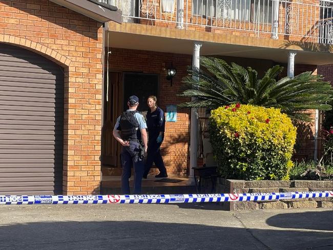 Officers searching the property for evidence. Picture: Madeline Crittenden