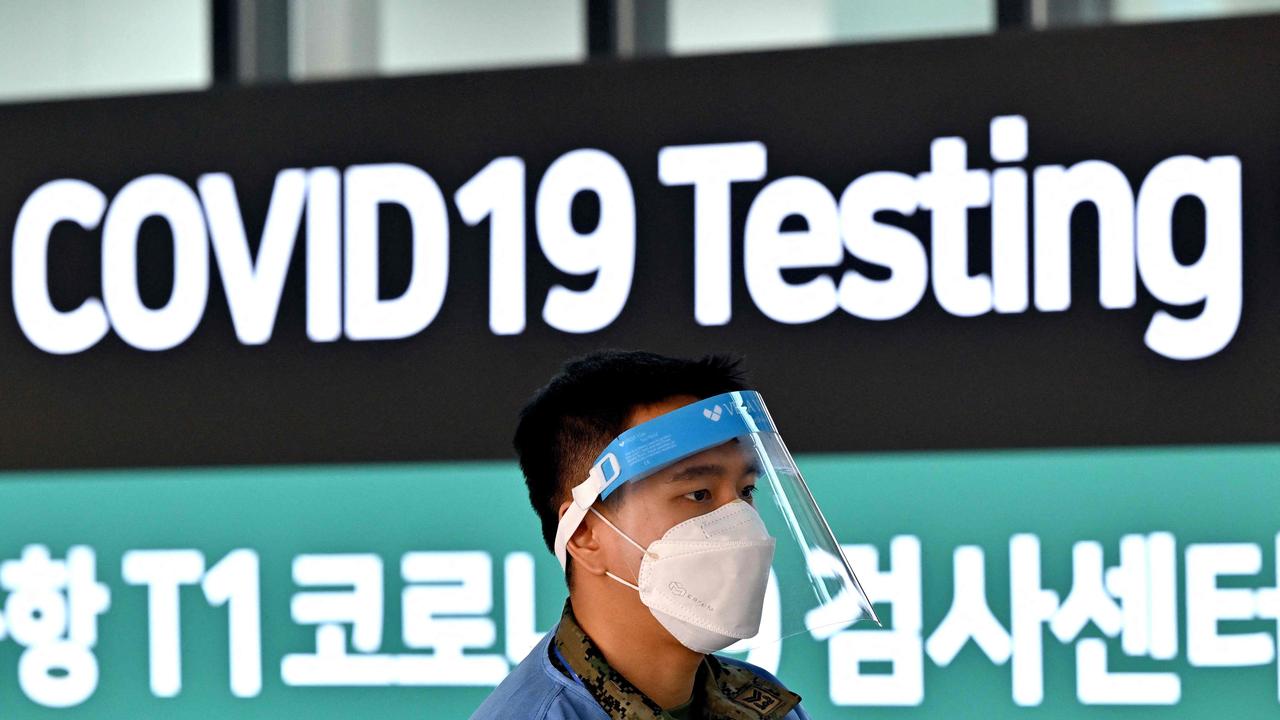 A health worker stands in front of a Covid-19 testing centre at Incheon International Airport, west of Seoul on January 3, 2023. Picture: Jung Yeon-je/AFP