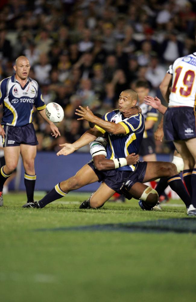 Paul Rauhihi gets the pass away as he gets tackled by Petero Civoniceva.