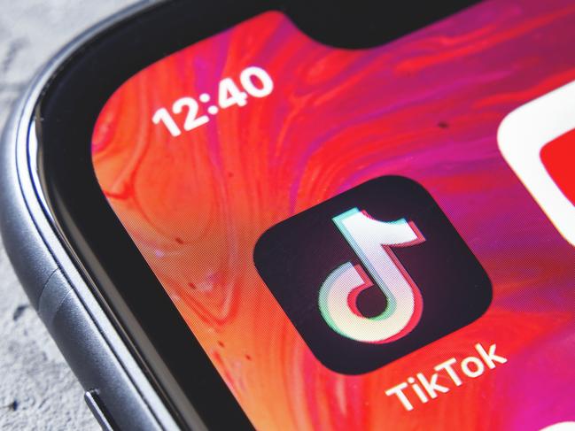 TikTok and YouTube apps on screen iphone xr, close up