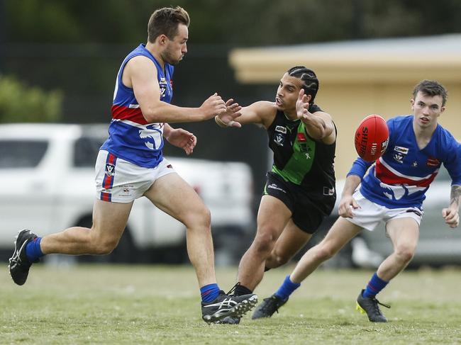 Tristan Warkuss (middle) in action for Doveton. Picture: Valeriu Campan