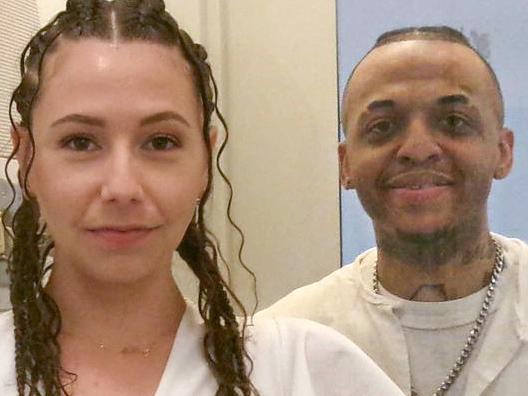 This photo from December 2024 courtesy of Helene Noa Dubois shows Steven Nelson, 37, and his wife, Helene Noa Dubois, standing on each side of a glass partition on their wedding day at the Allan B. Polunsky Unit, the prison that houses the 169 men on Texas' death row in Livingston, Texas. Nelson has spent more than a dozen years on Death Row in Texas and is to be executed by lethal injection on February 5, 2025, for the murder of a pastor that he insists he did not commit. "It's hard at times," the 37-year-old Nelson said in an interview with AFP at the maximum security prison in Livingston, a town 75 miles (120 kilometers) north of Houston, where he is awaiting his execution. "You're waiting to be put to death," he said. "So that kind of breaks a little part of you every day... You just don't want to do nothing." (Photo by Handout / FAMILY HANDOUT / AFP) / RESTRICTED TO EDITORIAL USE - MANDATORY CREDIT "AFP PHOTO / HANDOUT / HELENE NOA DUBOIS " - NO MARKETING NO ADVERTISING CAMPAIGNS - DISTRIBUTED AS A SERVICE TO CLIENTS / TO GO WITH AFP STORY by Cecile CLOCHERET and Francois PICARD, "'Breaks a little part of you every day': Texas man on Death Row"