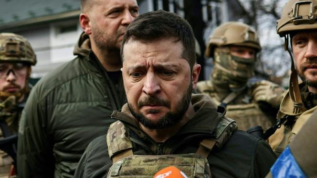 Ukrainian President Volodymyr Zelensky speaks to media in April in Bucha, where the bodies of civilians were found lying in the street after the town was retaken by the Ukrainian army. Picture: AFP