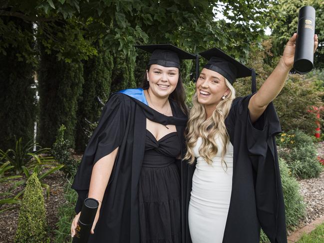 Celebrating their Bachelor of Science graduation are friends Danika Richardson (left) and Kirra Johnson at a UniSQ graduation ceremony at Empire Theatres, Tuesday, February 13, 2024. Picture: Kevin Farmer