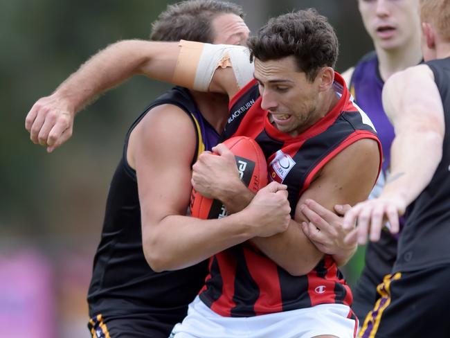 Nick Gray is caught in a tackle. Picture: Steve Tanner