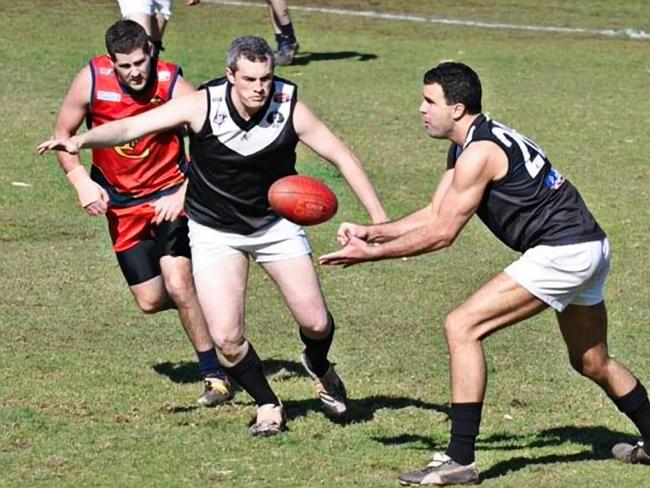 Capetal Advisory owner director Brad Green, centre, teaming up in 2013 with new South Australian premier Peter Malinauskas, right. in the premiership-winning Adelaide University blacks division AFL team. Malinauskas captained the team. Picture: Supplied