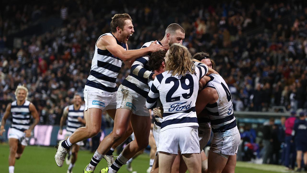 The Cats celebrate in front of their fans after Gary Rohan sunk the Dogs after the siren. Picture: Michael Klein