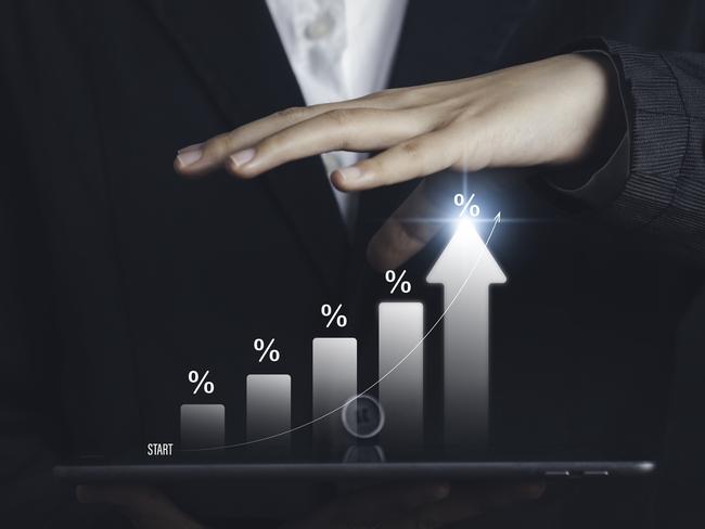 l businessman calculating investment income on a tablet with percentage symbol and up arrow, Interest rates continue to increase, return on stocks compound interest generic