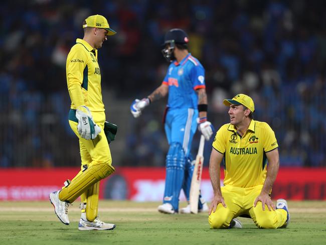 Alex Carey (L) and Mitch Marsh (R) react after dropping a catch from Virat Kohli. Picture: Getty Images