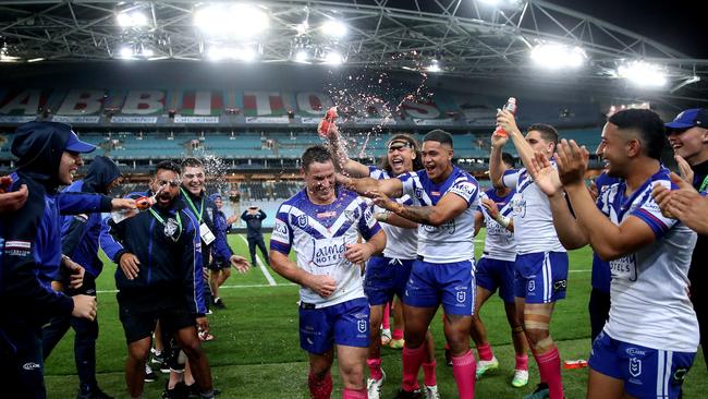 Bulldogs’ Josh Jackson is congratulated on his 200th game and win by teammates during NRL match between the South Sydney Rabbitohs and Canterbury Bulldogs at ANZ Stadium. Picture. Phil Hillyard