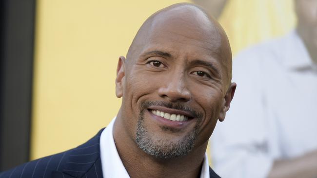 FILE - In this June 10, 2016 file photo, Dwayne Johnson attends the premiere of his film, "Central Intelligence" in Los Angeles. Johnson was named "Sexiest Man Alive" by People magazine on Nov. 15, 2016. (Photo by Richard Shotwell/Invision/AP, File)