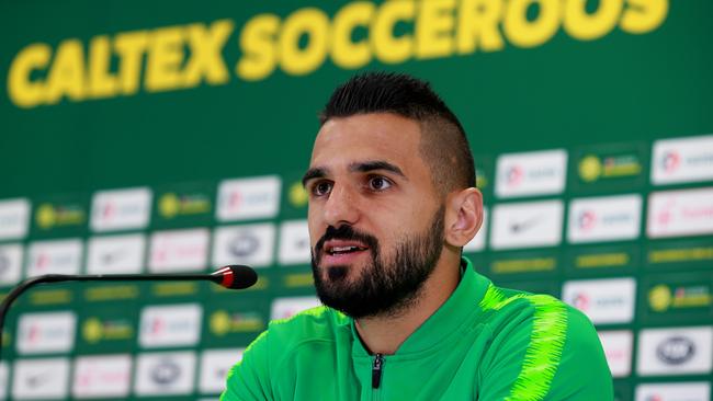 A quietly confident Aziz Behich addresses the press in Kazan. Picture: Toby Zerna