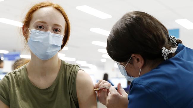 Amy Yarrow, 18, getting her second Covid-19 vaccination at Sydney Olympic Park. Picture: Jonathan Ng