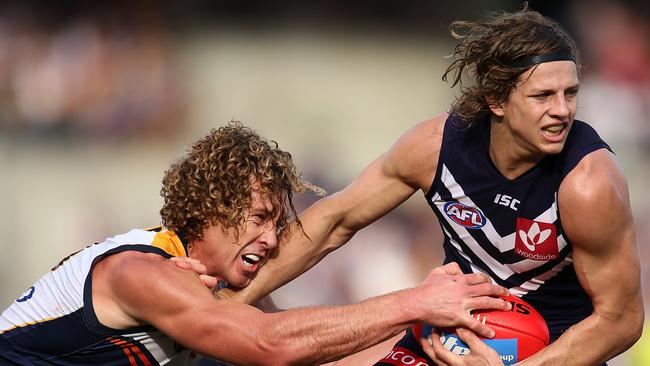 Matt Priddis attempts to strip Nat Fyfe off the ball in derby 42. Photo by Paul Kane.