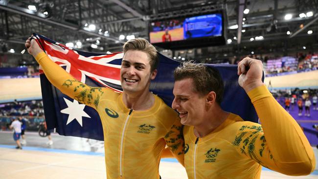 Richardson with Matthew Glaetzer after earning medals in the Keirin. Photo by SEBASTIEN BOZON / AFP