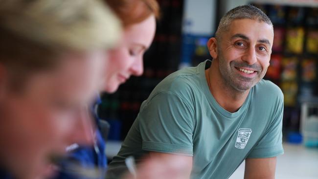 Sam Georges with paramedics at lunch time. Picture: Angelo Velardo