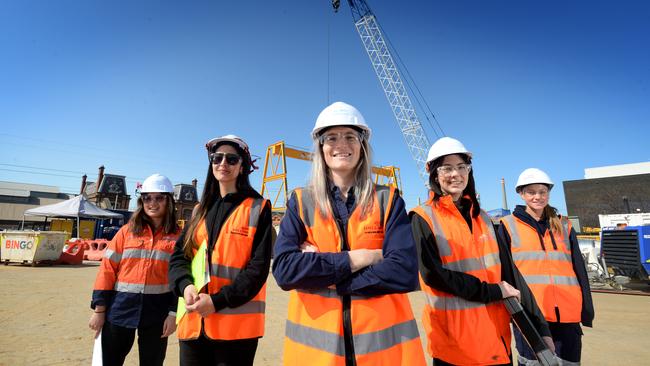 AFLW player and John Holland finance officer Kirsten McLeod (centre) with John Holland engineers Monica Santos-Chaney, Maria Agudelo, Lauren Knights and Libby Paynter at the Hobsons Bay main sewer upgrade project at Spotswood. Picture: Andrew Henshaw