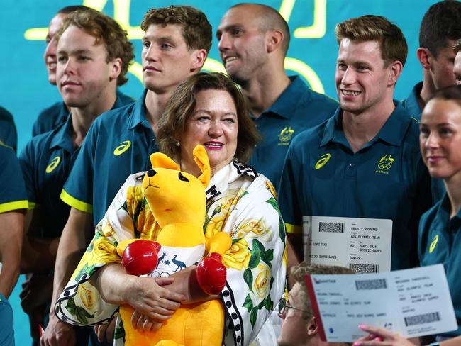 Gina Rinehart poses for a team photo with members of the Australian swimming team. Picture: Getty Images