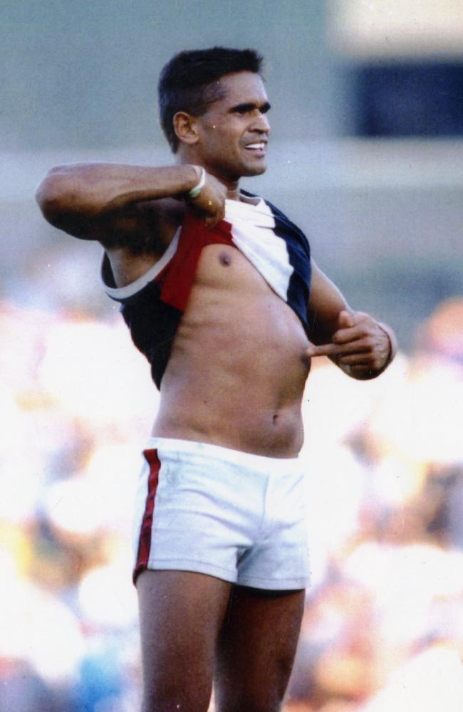 Nicky Winmar lifts his jumper and points to the colour of his skin in front of Collingwood supporters at Victoria Park in 1993. Picture: John Feder