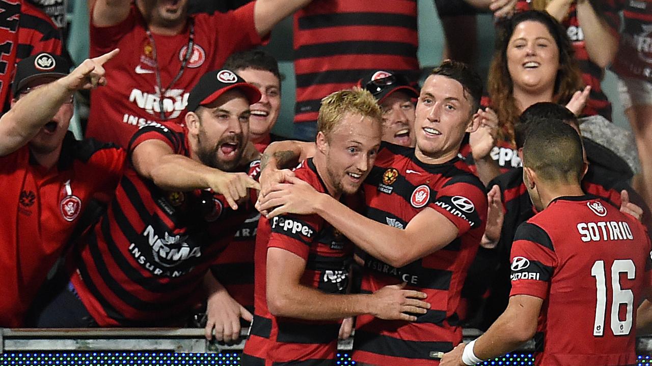 Mitch Nichols of the Wanderers celebrates his goal with Scott Neville during the round 9 A-League match between Western Sydney Wanderers and the Brisbane Roar at Allianz Stadium in Sydney, Saturday, Dec. 5, 2015. (AAP Image/Dean Lewins) NO ARCHIVING, EDITORIAL USE ONLY