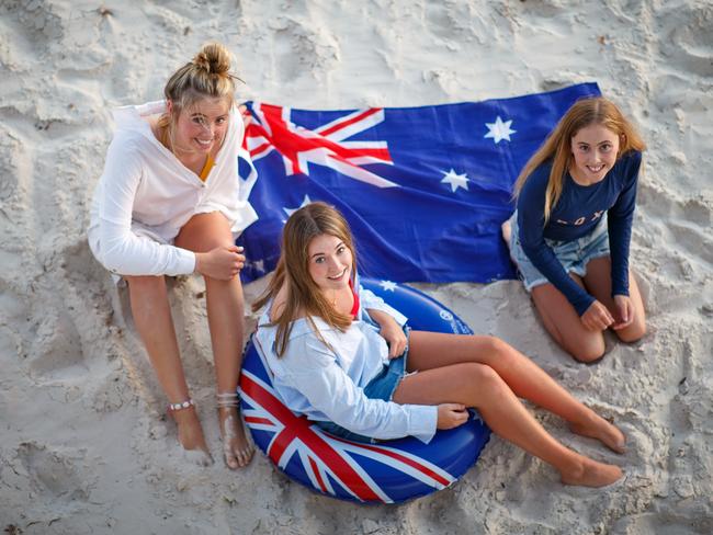 Corporations are being accused of being out-of-step of everyday Australians wanting to celebrate their national day, including Ava, Chloe and Eden Lange. Picture Matt Turner.