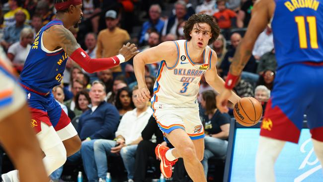 DENVER, CO - OCTOBER 22: Josh Giddey #3 of the Oklahoma City Thunder drives to the basket against the Denver Nuggets during the game at Ball Arena on October 22, 2022 in Denver, Colorado. NOTE TO USER: User expressly acknowledges and agrees that, by downloading and or using this Photograph, User is consenting to the terms and conditions of the Getty Images License Agreement. Mandatory Copyright Notice: Copyright 2022 NBAE (Photo by Justin Tafoya/Getty Images)