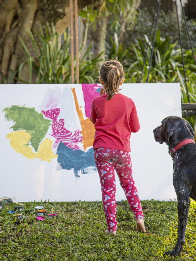 Young artist Claudia and Fergus the German Short haired pointer at home at Brookfield. Picture: SUPPLIED