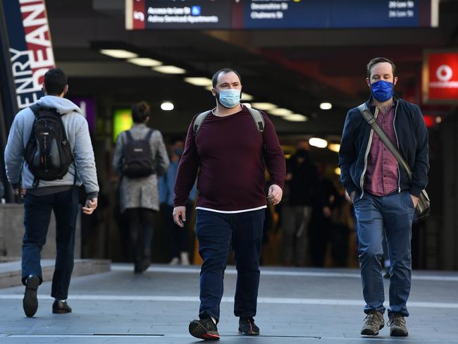 Commuters wear face masks as they leave Central Station in Sydney. Picture: NCA NewsWire/Joel Carrett