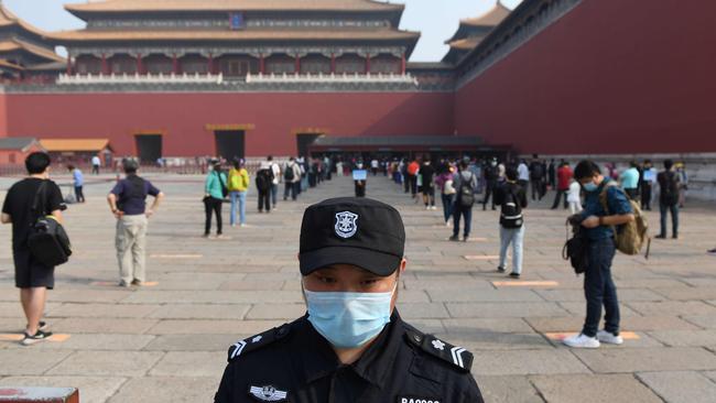 Social distancing outside Beijing’s Forbidden City on Friday. Picture: AFP