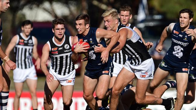 South's Joel Cross shrugs a Port Adelaide tackle at Hickinbotham Oval. Picture: Tom Huntley