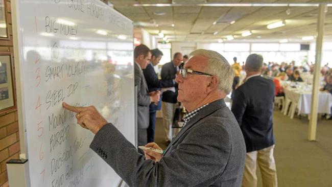 Chairman of NSW Country Racing Bob Pavitt writes up the barrier draw for the Ramornie Handicap at the CRJC Barrier Draw luncheon. Picture: Adam Hourigan