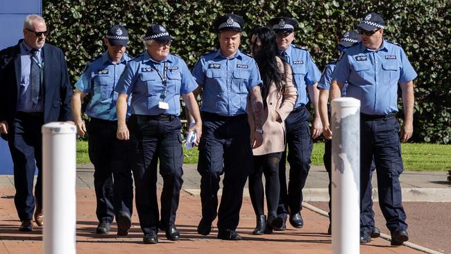 Show of support: Constable Brent Wyndham, fourth from the left, arrives to give evidence at the inquest into the death of Aboriginal woman JC in Geraldton. Picture: Graeme Gibbons