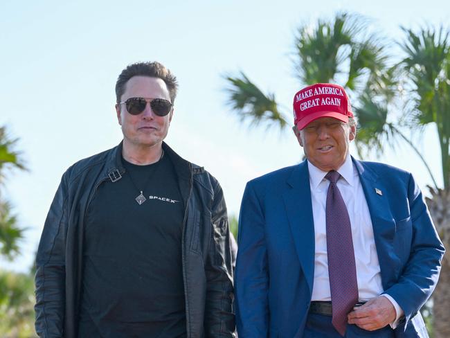 BROWNSVILLE, TEXAS - NOVEMBER 19: U.S. President-elect Donald Trump greets Elon Musk as he arrives to attend a viewing of the launch of the sixth test flight of the SpaceX Starship rocket on November 19, 2024 in Brownsville, Texas. SpaceXâs billionaire owner, Elon Musk, a Trump confidante, has been tapped to lead the new Department of Government Efficiency alongside former presidential candidate Vivek Ramaswamy.   Brandon Bell/Getty Images/AFP (Photo by Brandon Bell / GETTY IMAGES NORTH AMERICA / Getty Images via AFP)