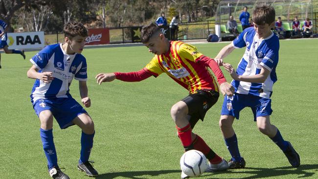 Action from the under-13 match between MetroStars and West Adelaide. Picture: Emma Brasier