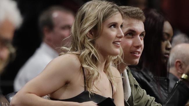 Eugenie Bouchard sits with her date John Goehrke. Picture: AP Photo