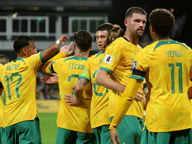 PERTH, AUSTRALIA - JUNE 11: Kusini Yengi of the Socceroos celebrates with team mates after scoring a goal during the Second Round FIFA World Cup 2026 Qualifier match between Australia Socceroos and Palestine at HBF Park on June 11, 2024 in Perth, Australia. (Photo by Will Russell/Getty Images)