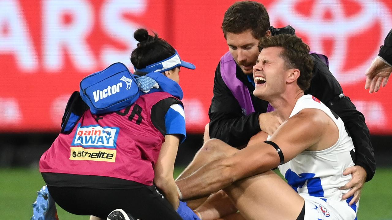 Charlie Comben is attended to after suffering a broken leg. (Photo by Quinn Rooney/Getty Images)