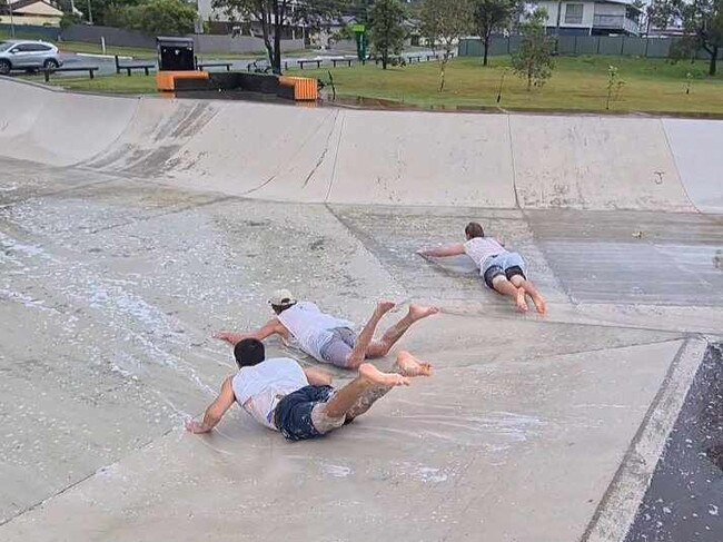 Logan boys having fun at the skate park in Tudor Park, Loganholme during Cyclone Alfred. Picture: Jodie O'Brien